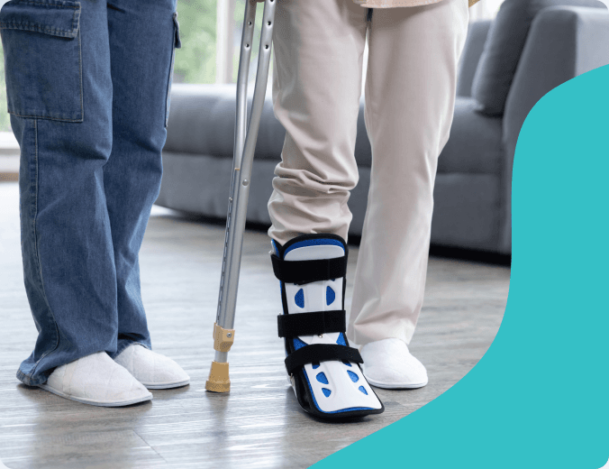 Caregiver providing shoulder support to an older adult