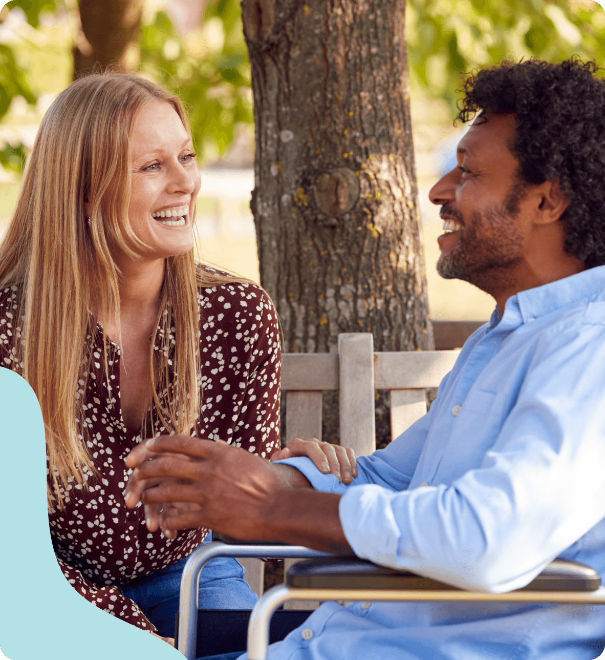 Care worker and client talking outdoors