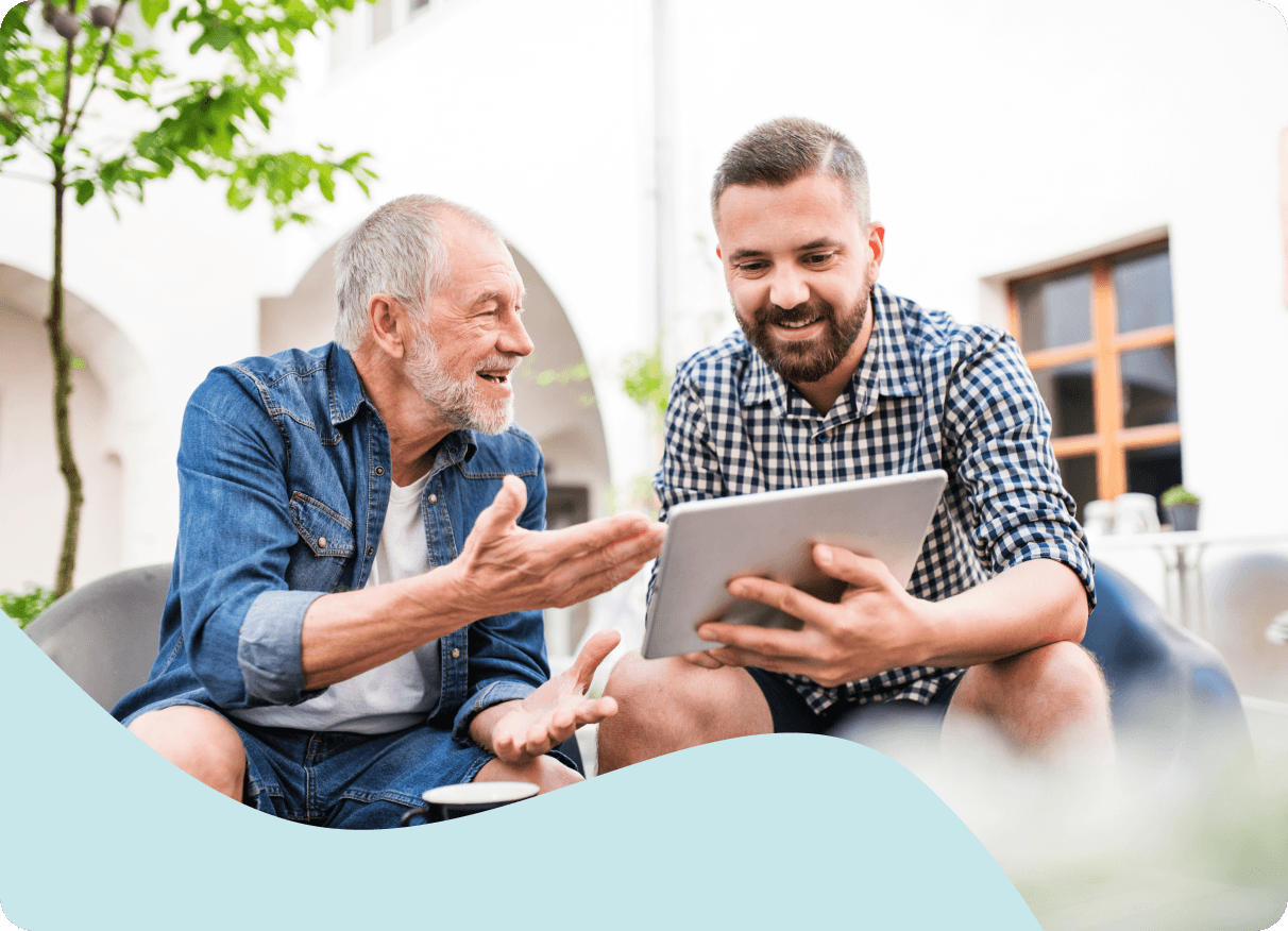 Caregiver providing companionship to an older adult at home