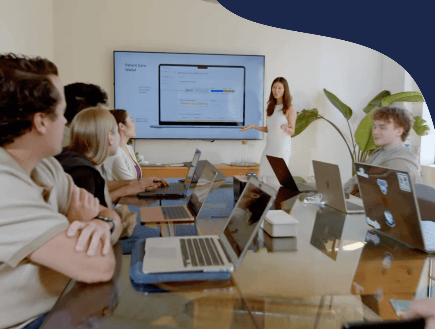 Care partners collaborating around a boardroom table