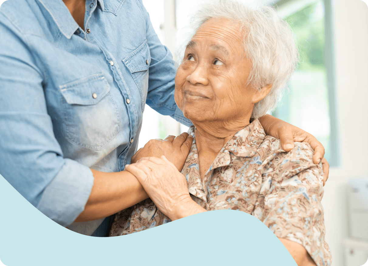 Caregiver providing companionship to an older adult at home